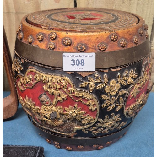 308 - 1920's Chinese wood and lacquered lidded rice barrel decorated with relief gilt figures and foliage.... 