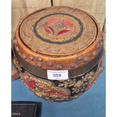 308 - 1920's Chinese wood and lacquered lidded rice barrel decorated with relief gilt figures and foliage.... 