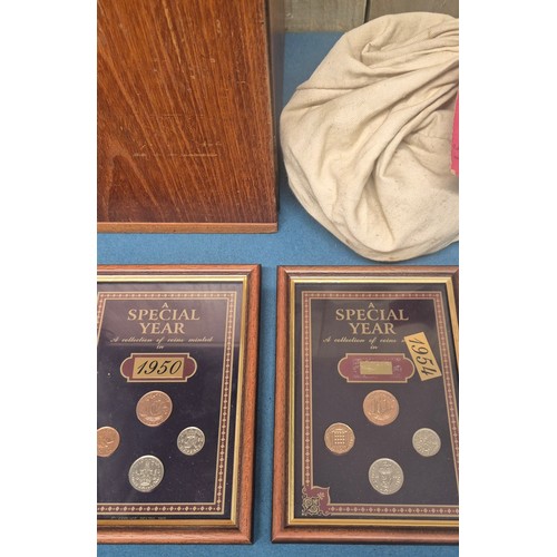 306 - Crate of coin protectors and coins; Teak multi drawer coin chest with key. Various coin protector st... 