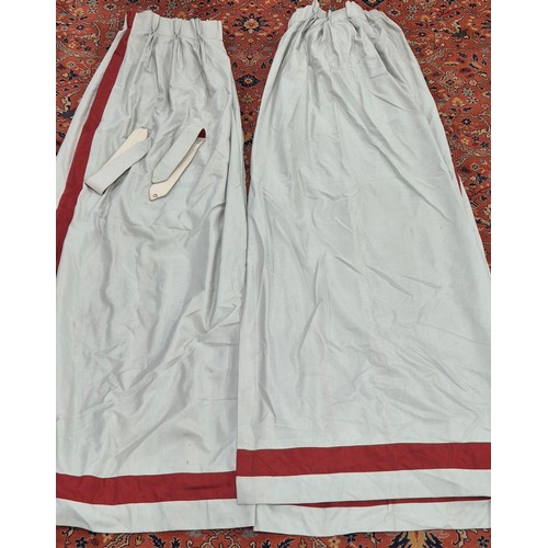 329 - Two pairs of Large double lined curtains. 275cm drop. Comes with four tie backs. Grey ground and red... 