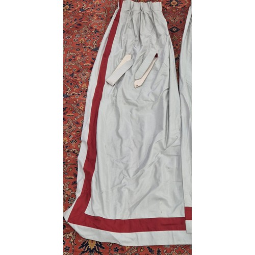 329 - Two pairs of Large double lined curtains. 275cm drop. Comes with four tie backs. Grey ground and red... 