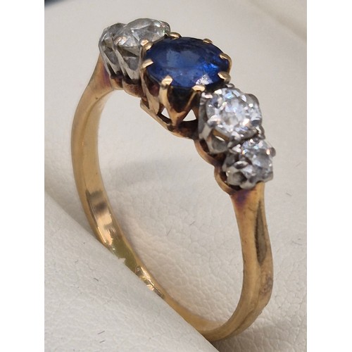 80 - 18ct yellow gold blue topaz and diamond stone ring. Round cut topaz and four round cut diamonds. 0.2... 