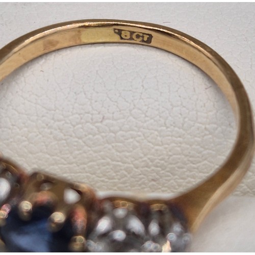 80 - 18ct yellow gold blue topaz and diamond stone ring. Round cut topaz and four round cut diamonds. 0.2... 