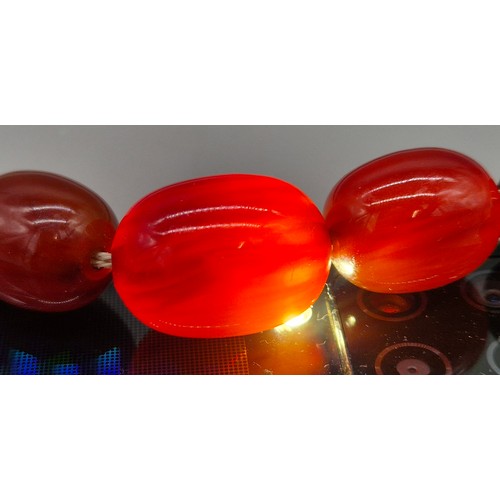 82 - Vintage Bakelite Cherry Amber Graduating Bead Necklace. 56.87grams.