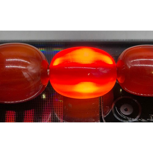 82 - Vintage Bakelite Cherry Amber Graduating Bead Necklace. 56.87grams.