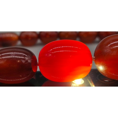 82 - Vintage Bakelite Cherry Amber Graduating Bead Necklace. 56.87grams.