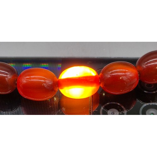 82 - Vintage Bakelite Cherry Amber Graduating Bead Necklace. 56.87grams.