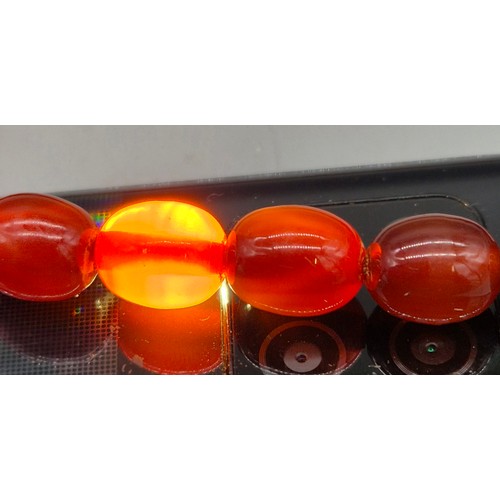 82 - Vintage Bakelite Cherry Amber Graduating Bead Necklace. 56.87grams.