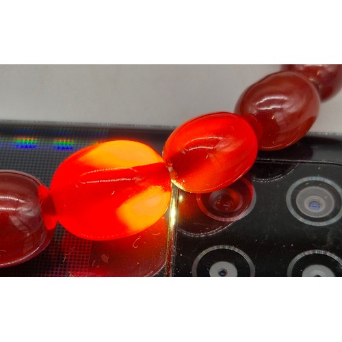 82 - Vintage Bakelite Cherry Amber Graduating Bead Necklace. 56.87grams.