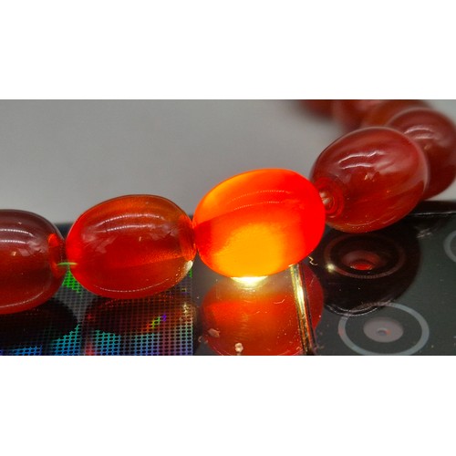 82 - Vintage Bakelite Cherry Amber Graduating Bead Necklace. 56.87grams.