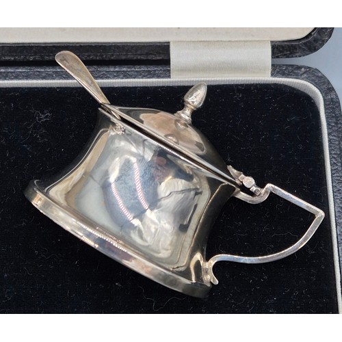 76 - A Boxed Birmingham Silver three piece condiment set with two silver spoons.