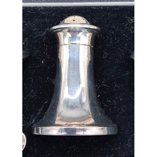 76 - A Boxed Birmingham Silver three piece condiment set with two silver spoons.