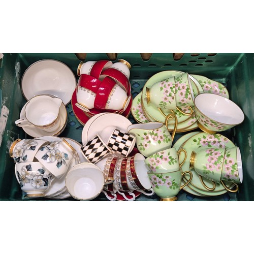 386 - Crate of porcelain tea sets; Royal Tuscan M.Kirkwood design tea set, Royal Staffordshire tea wares a... 