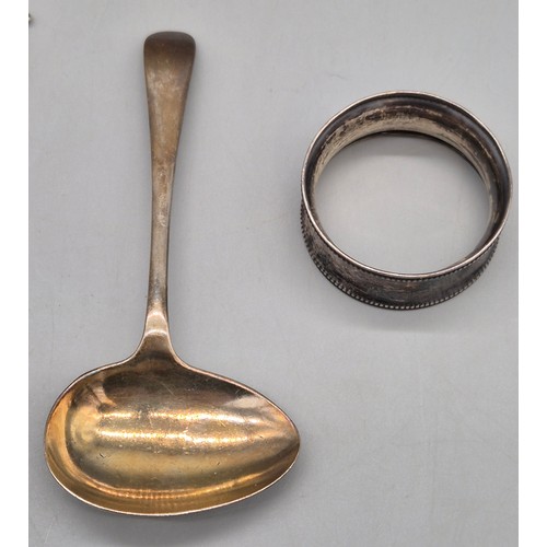77 - A Selection of silver items; Pair of silver napkin rings, feeding spoon, pusher and tea spoon. 84gra... 
