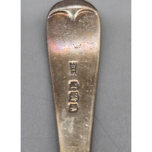 77 - A Selection of silver items; Pair of silver napkin rings, feeding spoon, pusher and tea spoon. 84gra... 