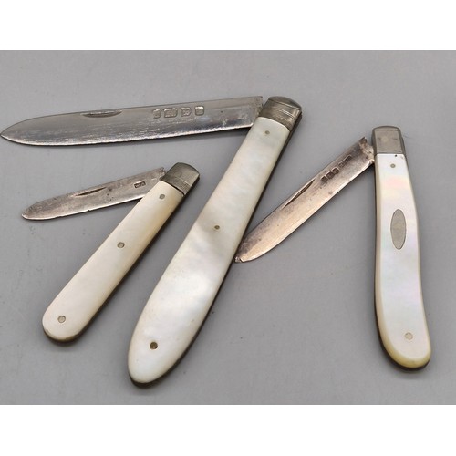 79 - A Selection of silver items; Three silver and mother of pearl fruit knives. Edinburgh silver tea cad... 