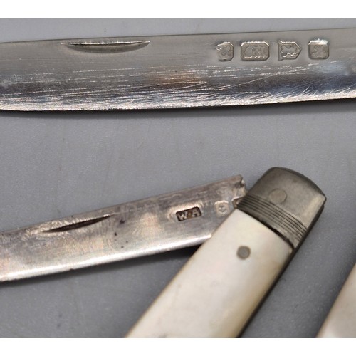 79 - A Selection of silver items; Three silver and mother of pearl fruit knives. Edinburgh silver tea cad... 