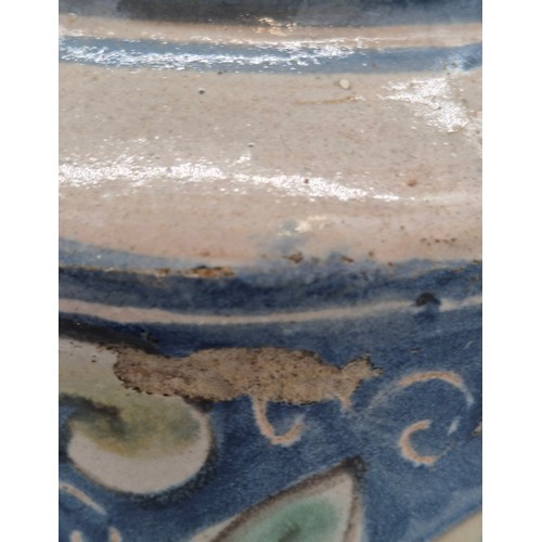 438 - A Sicilian Maiolica Albarello. 17th/ 18th century. 24cm high.