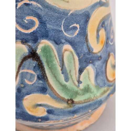 438 - A Sicilian Maiolica Albarello. 17th/ 18th century. 24cm high.