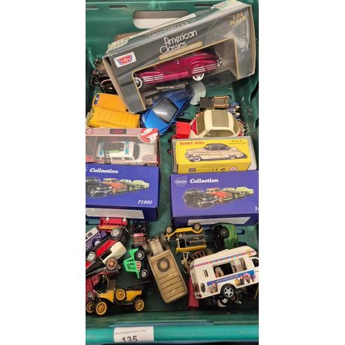 135 - Two crates of model vehicles; boxed Dinky model, Ghost Busters boxed model, Maisto and Volvo collect... 