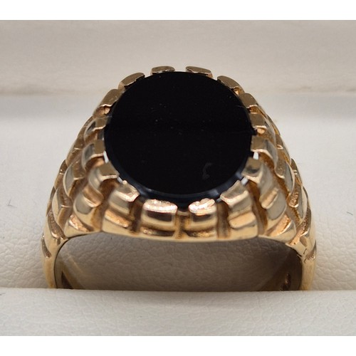 4 - 9ct yellow gold and onyx signet ring. Ring size U. 8.13Grams.