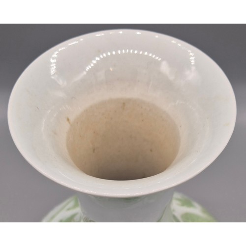 173 - Antique Chinese raised relief dragon pattern vase with reign mark to base on a wood carved stand.