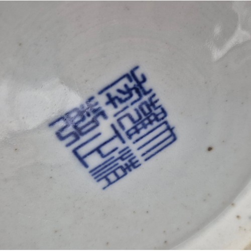 173 - Antique Chinese raised relief dragon pattern vase with reign mark to base on a wood carved stand.