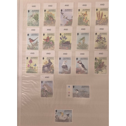 226 - Tray of seven stamp albums containing Guernsey stamps.