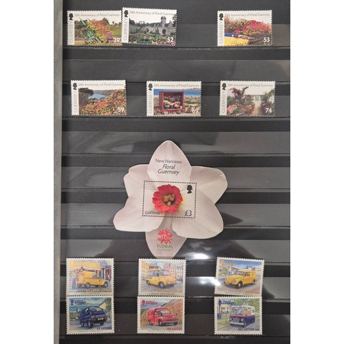 226 - Tray of seven stamp albums containing Guernsey stamps.