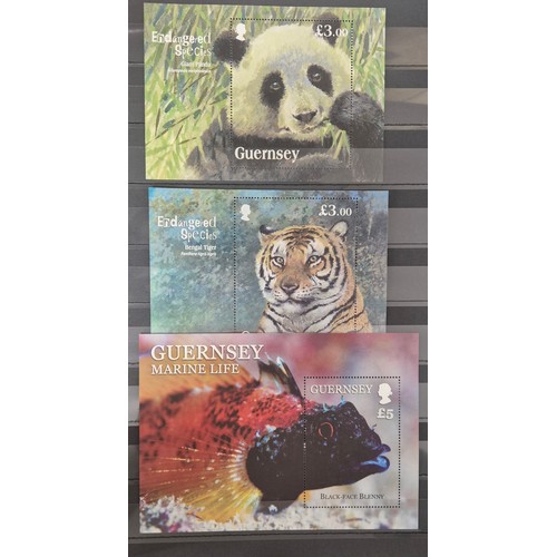 226 - Tray of seven stamp albums containing Guernsey stamps.