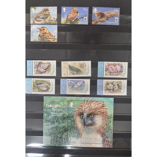 226 - Tray of seven stamp albums containing Guernsey stamps.