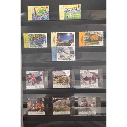 226 - Tray of seven stamp albums containing Guernsey stamps.