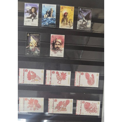 226 - Tray of seven stamp albums containing Guernsey stamps.