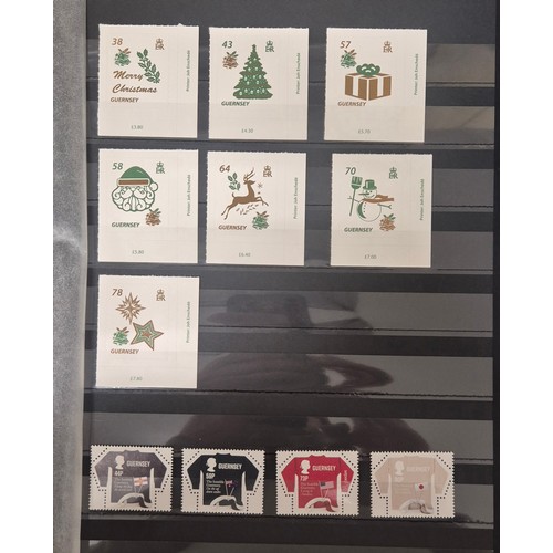 226 - Tray of seven stamp albums containing Guernsey stamps.