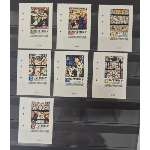 226 - Tray of seven stamp albums containing Guernsey stamps.