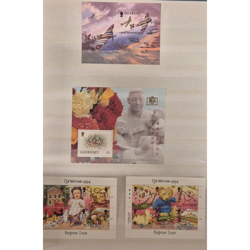 226 - Tray of seven stamp albums containing Guernsey stamps.