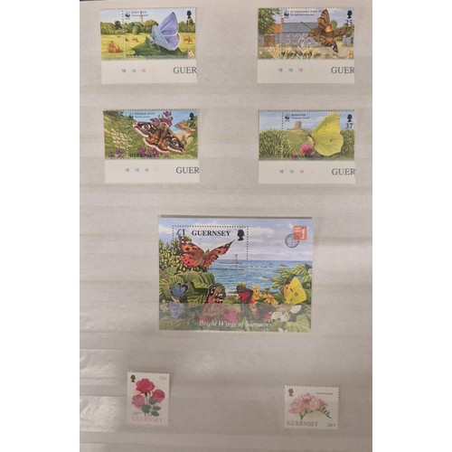 226 - Tray of seven stamp albums containing Guernsey stamps.