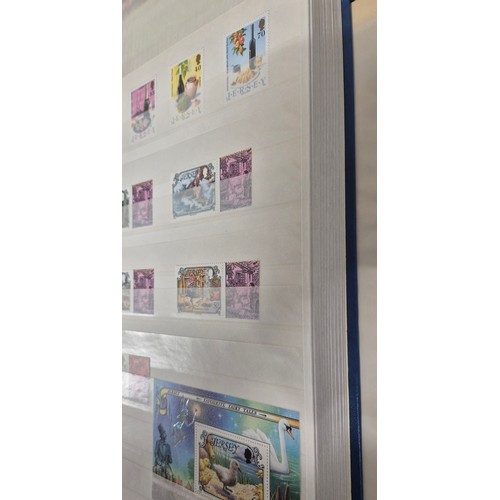 227 - Tray of seven stamp albums containing Jersey stamps.