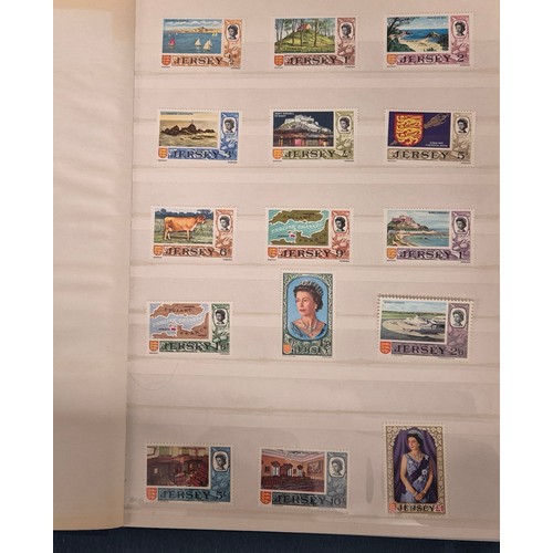 227 - Tray of seven stamp albums containing Jersey stamps.