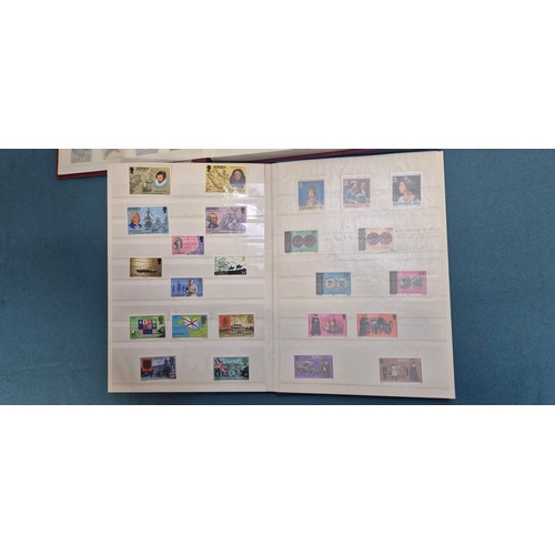 227 - Tray of seven stamp albums containing Jersey stamps.