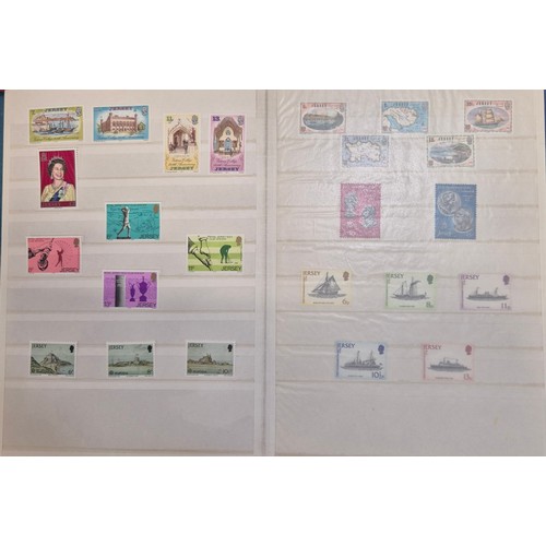 227 - Tray of seven stamp albums containing Jersey stamps.