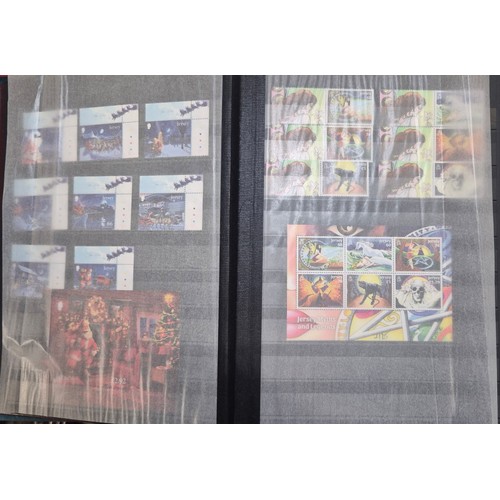 227 - Tray of seven stamp albums containing Jersey stamps.