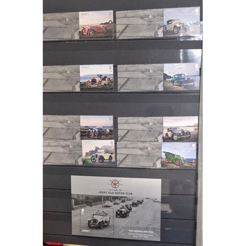 227 - Tray of seven stamp albums containing Jersey stamps.