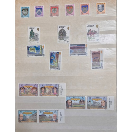 227 - Tray of seven stamp albums containing Jersey stamps.