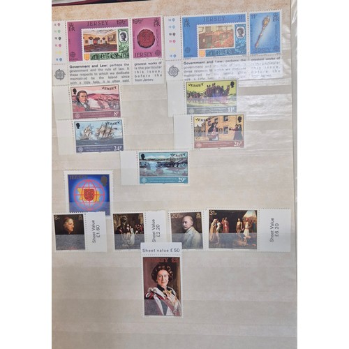 227 - Tray of seven stamp albums containing Jersey stamps.