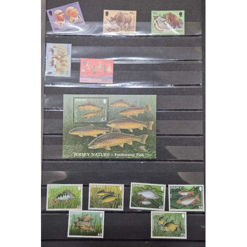 227 - Tray of seven stamp albums containing Jersey stamps.