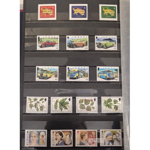 227 - Tray of seven stamp albums containing Jersey stamps.