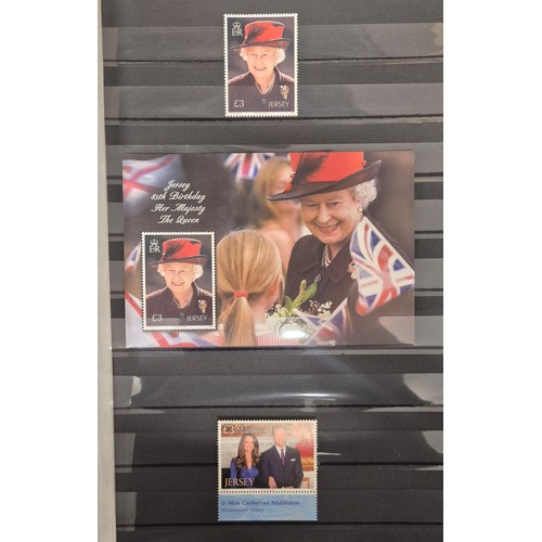 227 - Tray of seven stamp albums containing Jersey stamps.