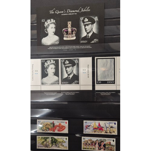 227 - Tray of seven stamp albums containing Jersey stamps.