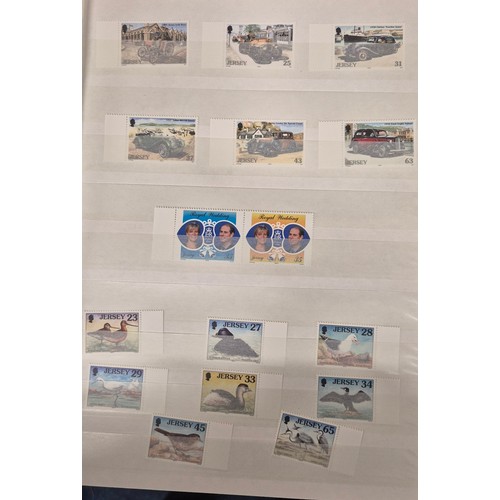 227 - Tray of seven stamp albums containing Jersey stamps.